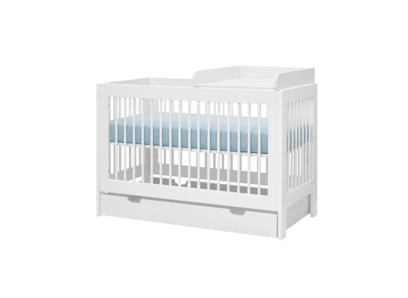 Białe łóżeczko dla dziecka z przewijakiem i dolną szufladą